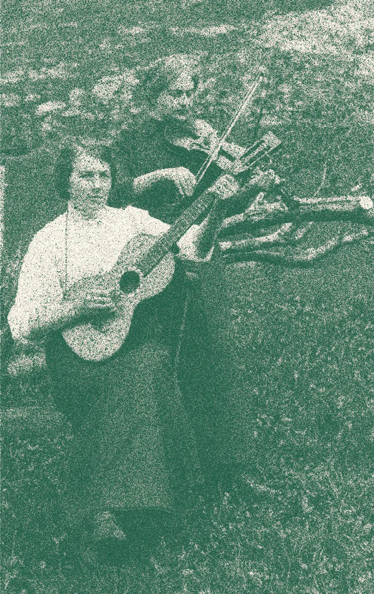 Vintage photo of a woman playing guitar beside a fiddle player